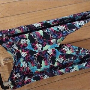 LuLaRoe Multicolor Patterned Leggings With CRUELLA Deville.